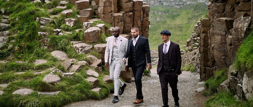 a group of men in suits walking on a path and wearing amen shoes uk  shoes